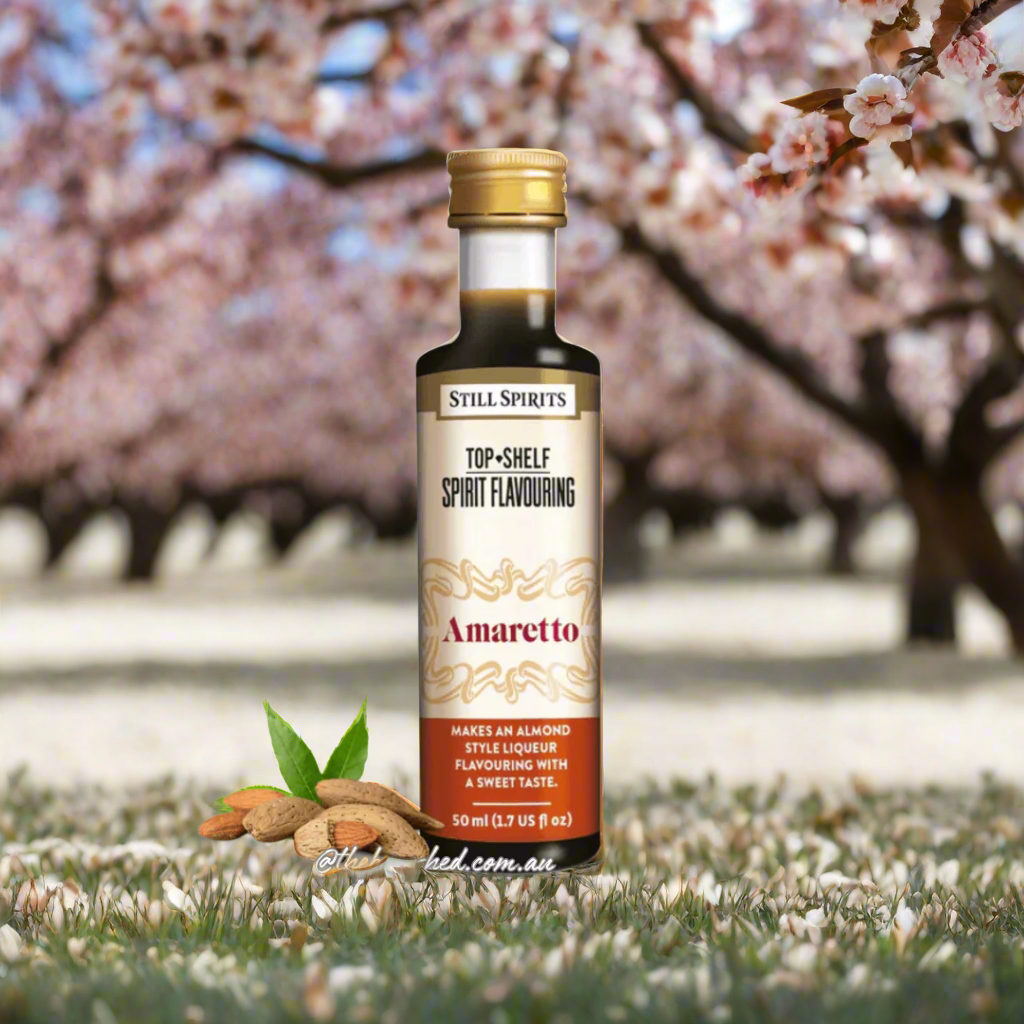 plastic bottlewith dark liquid inside almonds next to bottle