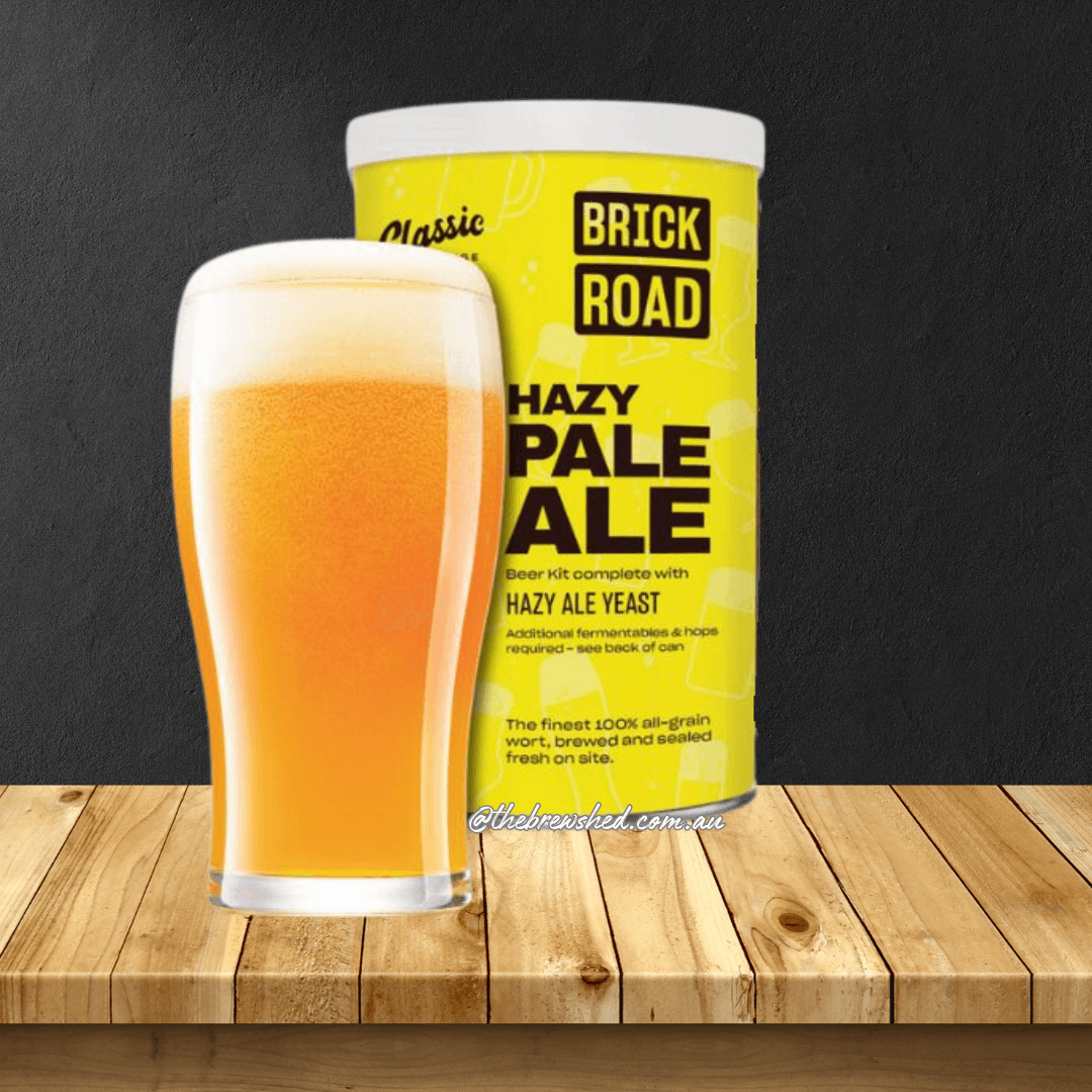 glas of cloudy beer ext to bright yelow can