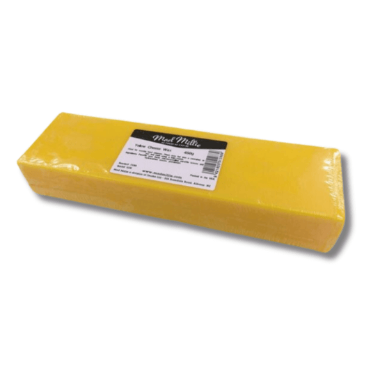 yellow block of wax in sealed plastic wrap