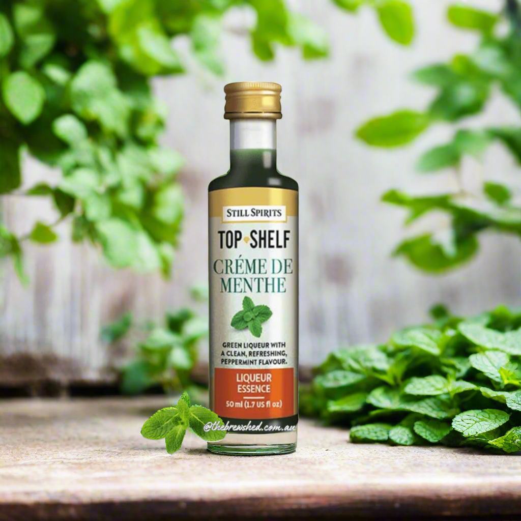 clear bottle with gold lid and green liquid inside