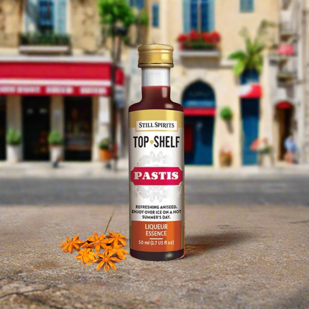 a gold and white label with dark liquid inside and anised cloves next to it