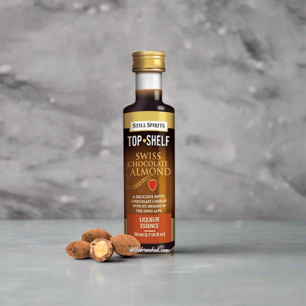 delicious chocolate coated almonds next to a brown labelled bottle