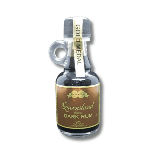 tiny glass bottle with cute handle filled with dark coloured rum spirit essence