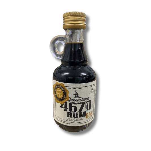 cute glass bottle with little handle and gold cap, with rum flavour essence for homebrewing in side