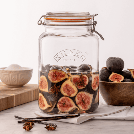 clear square glass jar with preserved figs inside