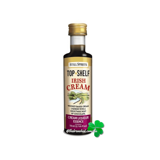 shamrock leaf at the front of a clear bottle with dark liquid inside