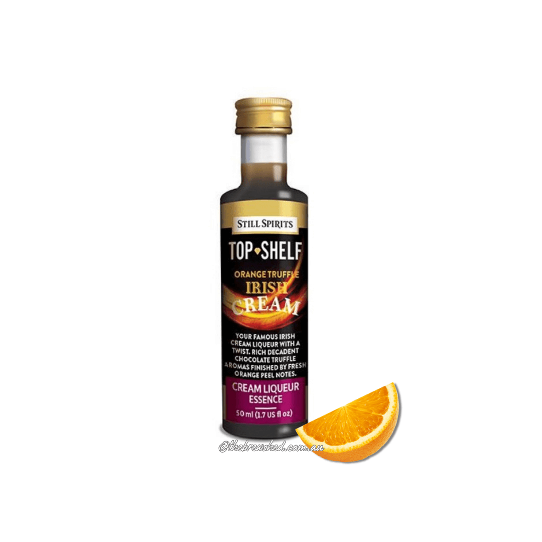 orange slice with bottle of dark liquid inside, black and orange label