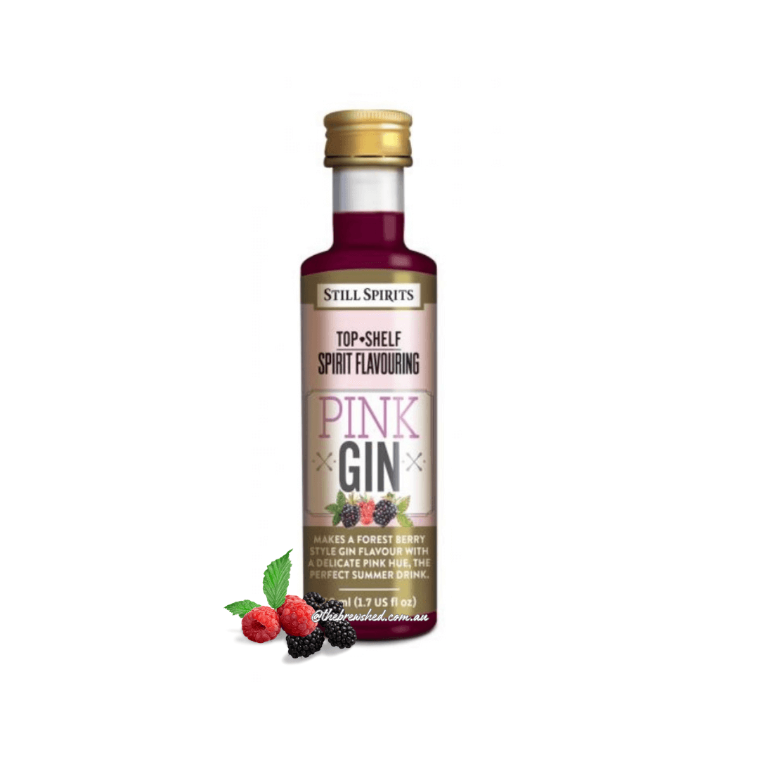 pink liquid in a clear bottle with fresh raspberries and blacberries on the label