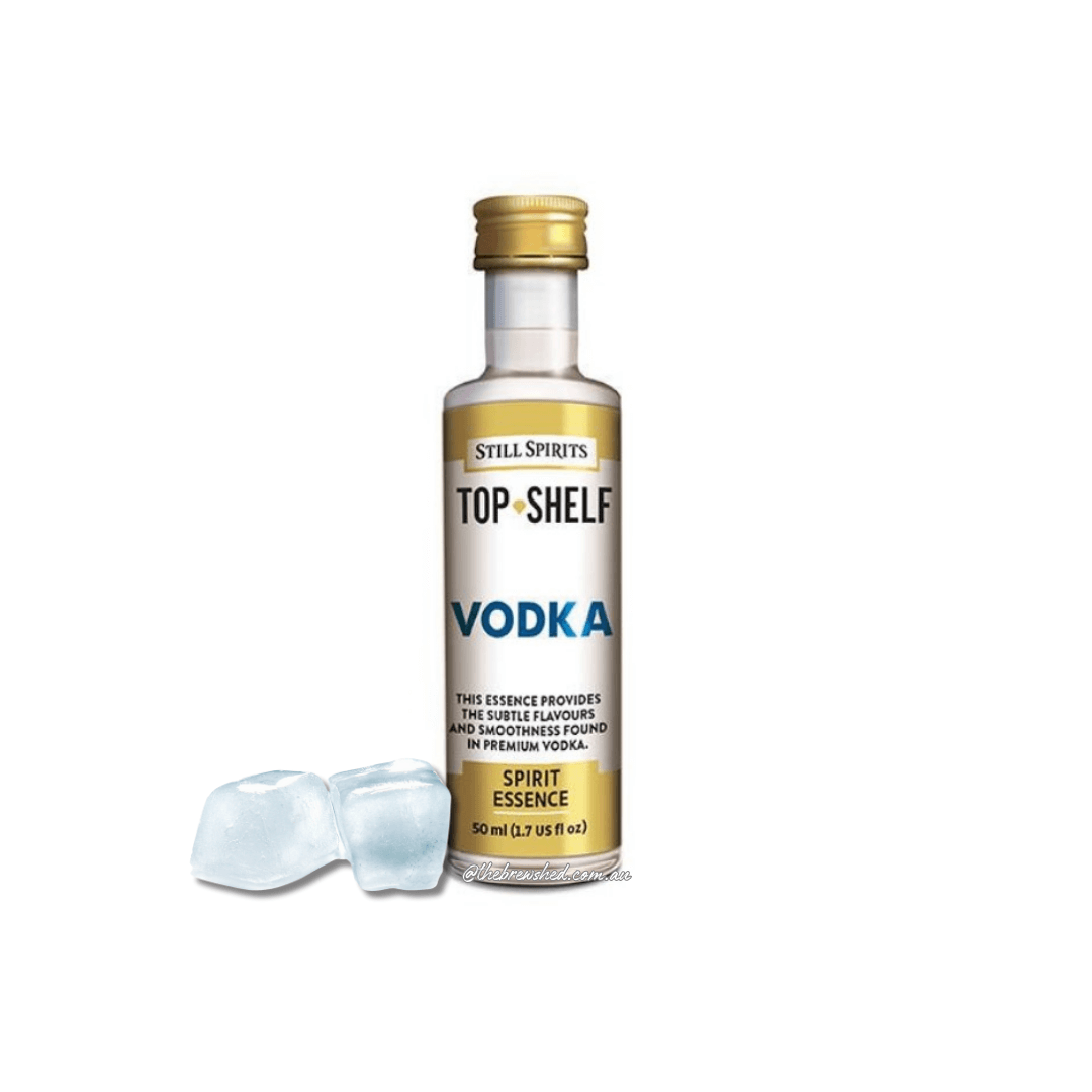 glacial coloured ice cubes next to a bottle with gold and white label